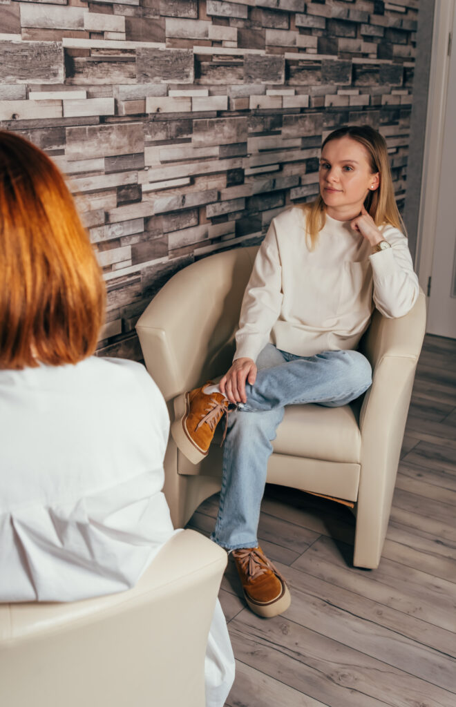 Psychotherapy consultation. Counselor talking to woman on meeting at office, giving advice to young client. Depressed woman speaking to a therapist. Psychologist having session with her female patient