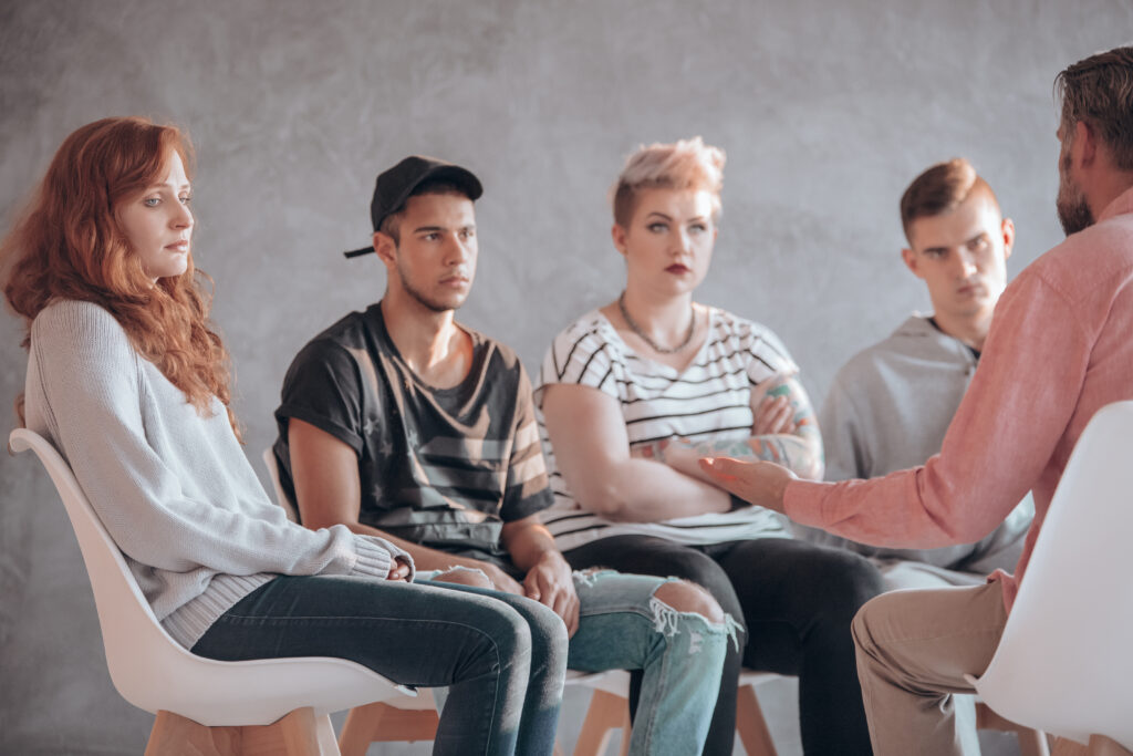 Troubled youth having a therapeutic session with a counselor