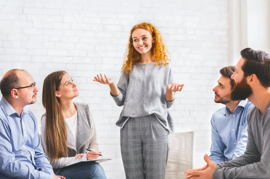 People participate in therapy at a drug rehab center.