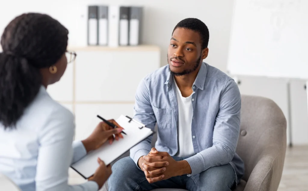 A man participates in therapy at a drug rehab center.