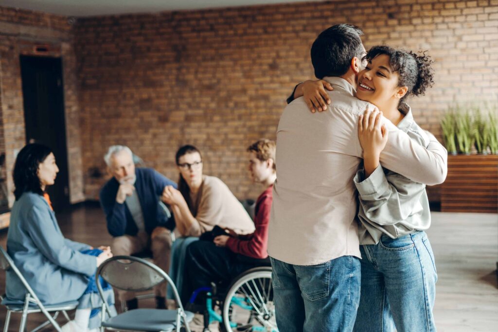 Woman hugging a man after attending sebastopol rehab.